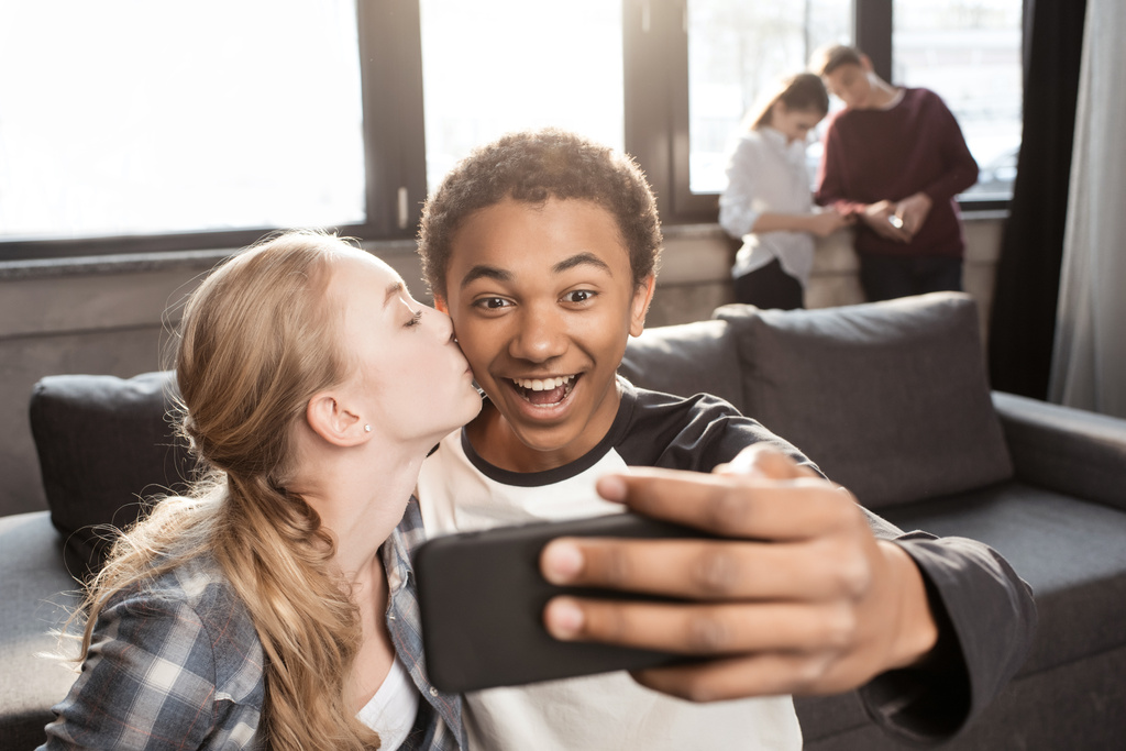 Teenage couple taking selfie  - Photo, Image