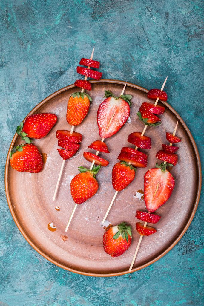 strawberries on wooden skewers - Photo, Image