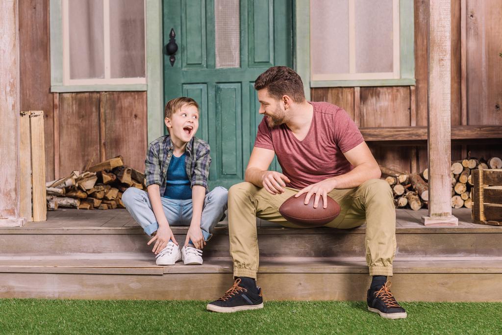 father with son sitting on porch  - Photo, Image