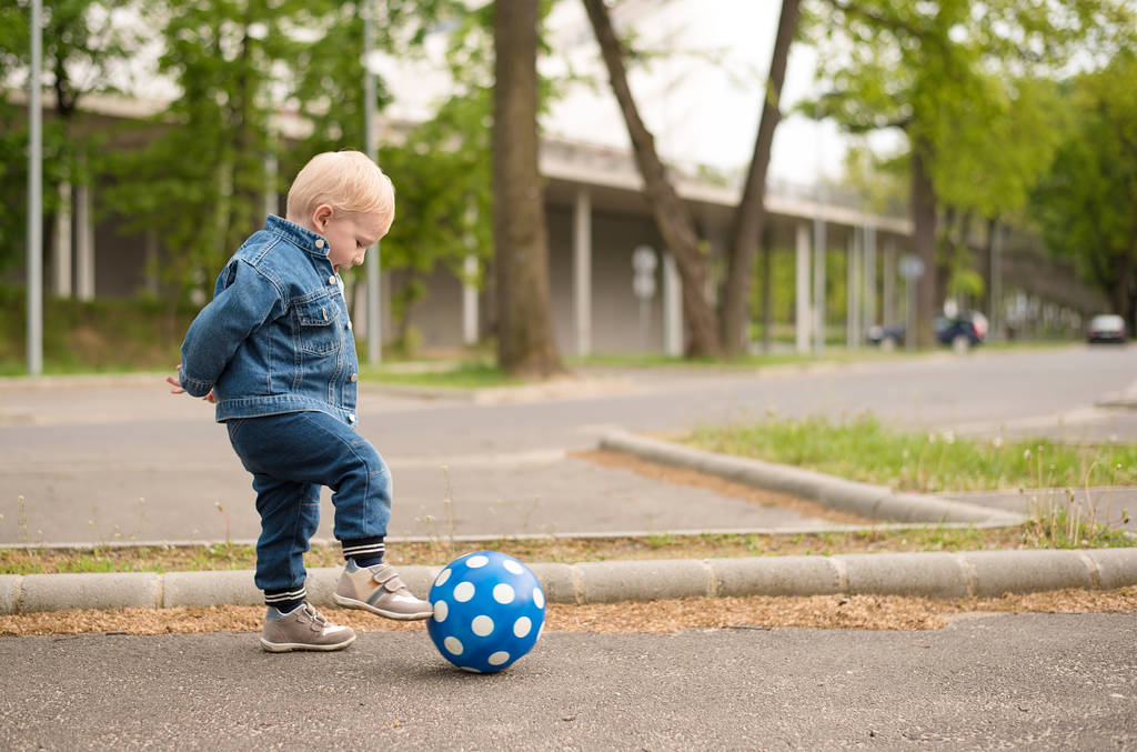 Happy kid playing football - Photo, Image