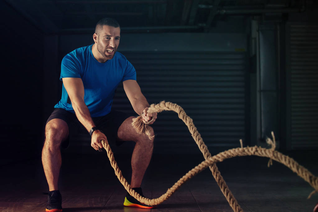 Man is training with rope - Photo, Image