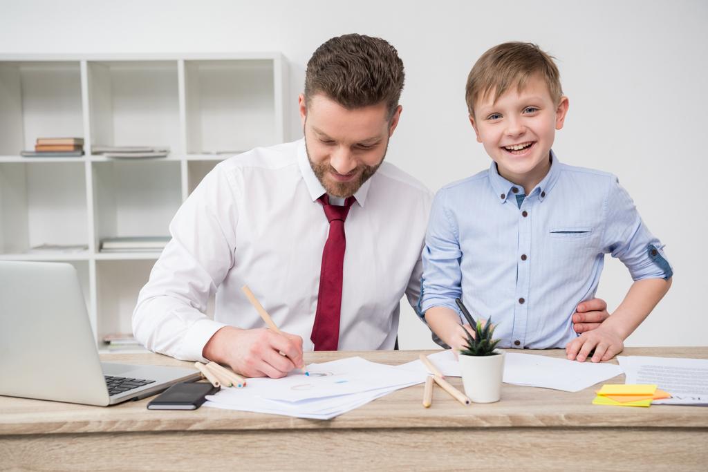 Businessman with son in office  - Photo, Image