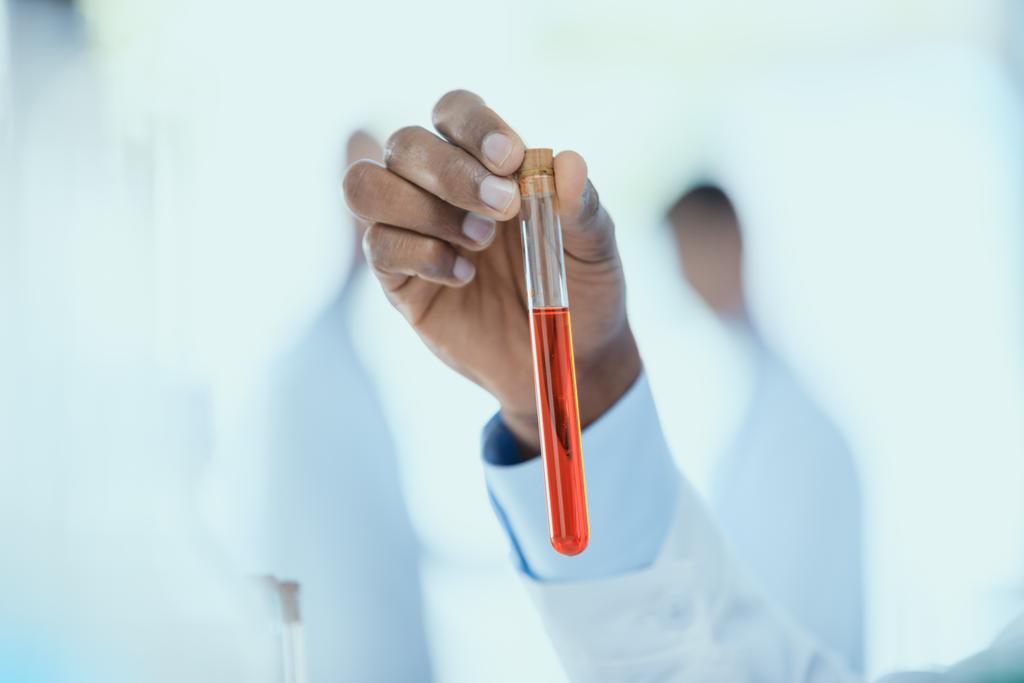 Scientist holding test tube  - Photo, Image