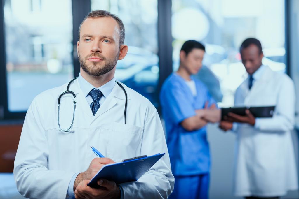 confident doctor with folder - Photo, Image