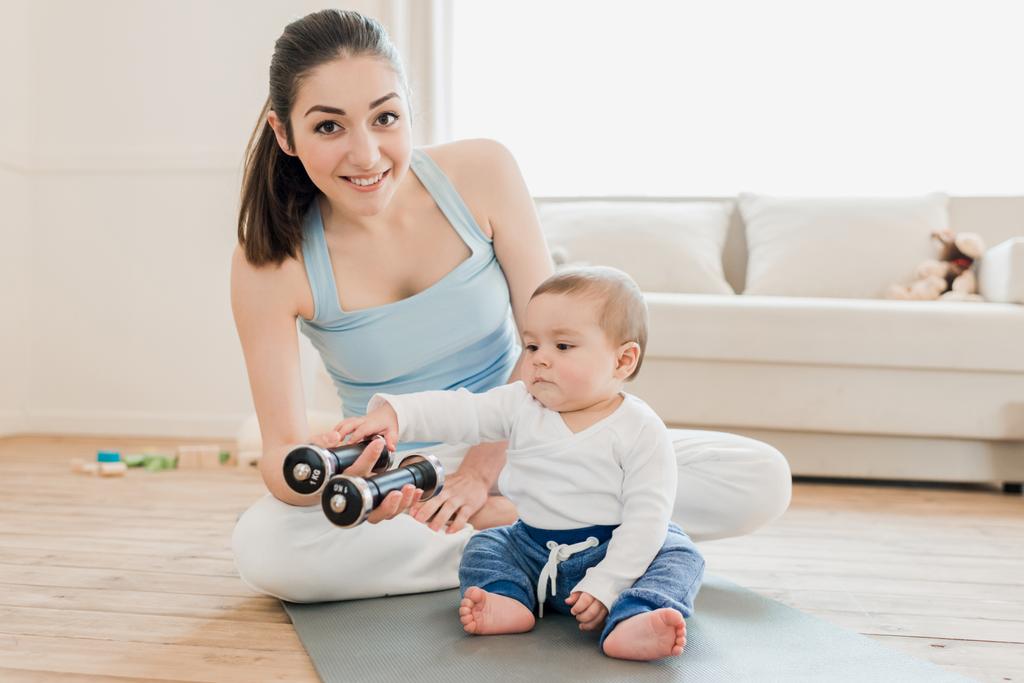 Woman with baby child playing together - Photo, Image