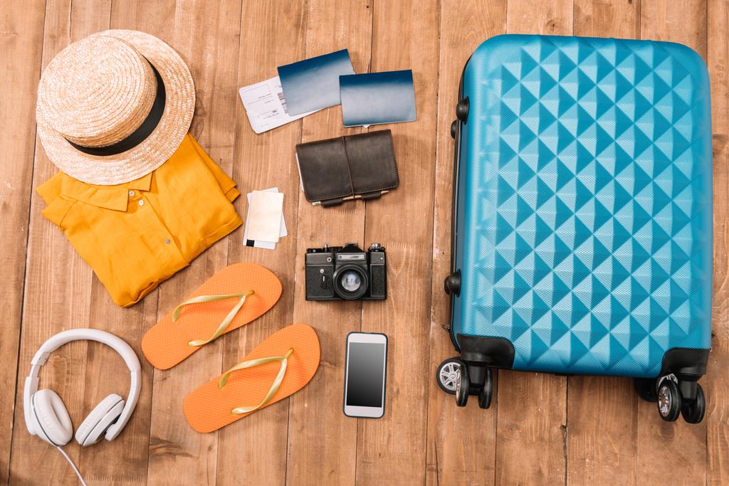travel accessories on wooden floor  - Photo, Image