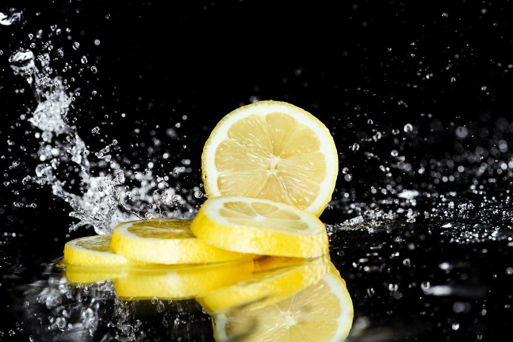 Sliced lemon with water drops  - Photo, Image