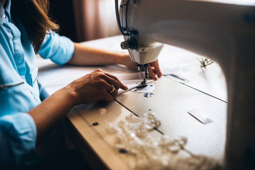 Girl sewing wedding dress - Photo, Image