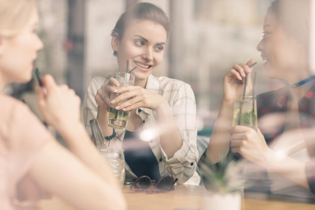 girls drinking cocktails in cafe - Photo, Image