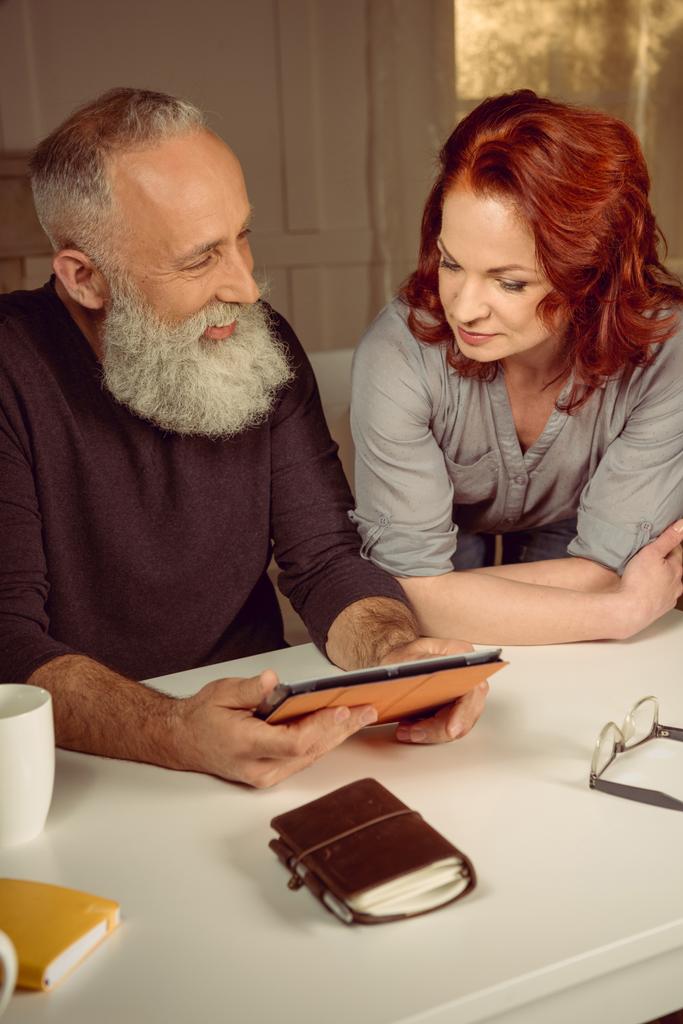 middle aged couple using digital tablet - Photo, Image