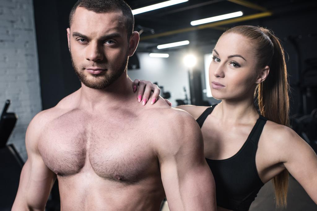 sportive couple posing at gym - Photo, Image