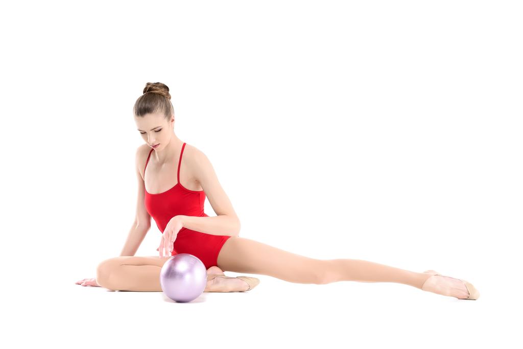 rhythmic gymnast exercising with ball - Photo, Image
