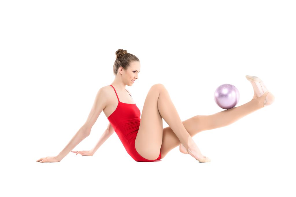 rhythmic gymnast exercising with ball - Photo, Image