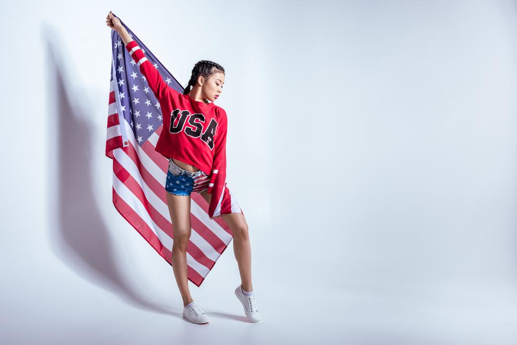 menina asiática com bandeira americana
 - Foto, Imagem