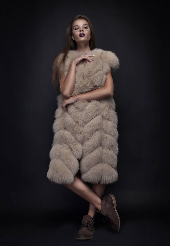 Beauty Fashion Model Girl in Blue Mink Fur Coat. Beautiful Luxury Winter Woman with creative make writing fuck you on face - Photo, Image
