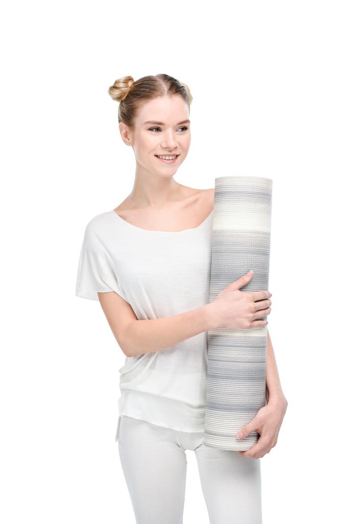 Дівчина тримає йогу килимок
 - Фото, зображення