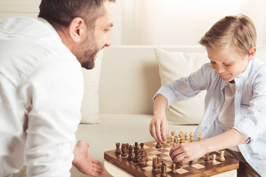 boy playing chess with father - Photo, Image
