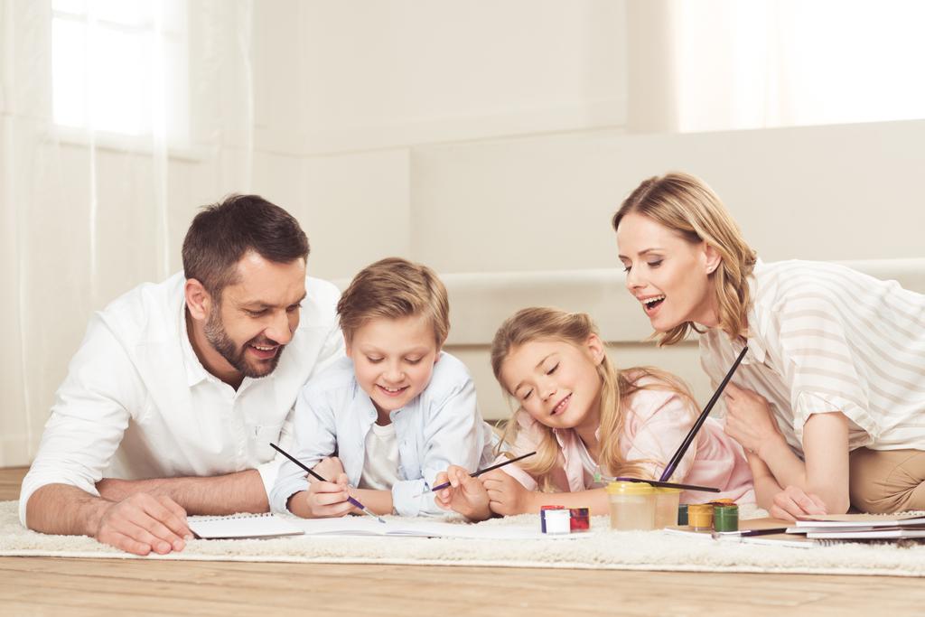 happy family drawing pictures at home - Photo, Image