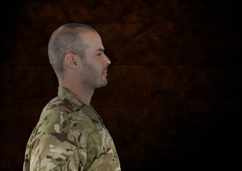 Żołnierz czołowej z czerwonym i czarnym tle - Zdjęcie, obraz