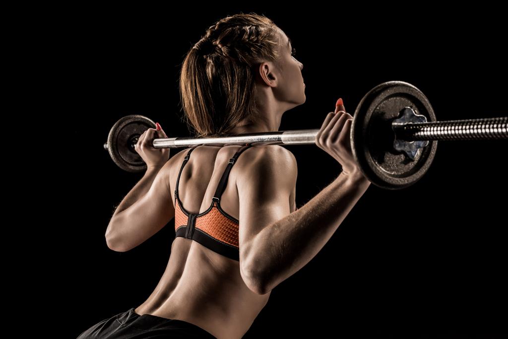 Sportswoman training with barbell  - Photo, Image