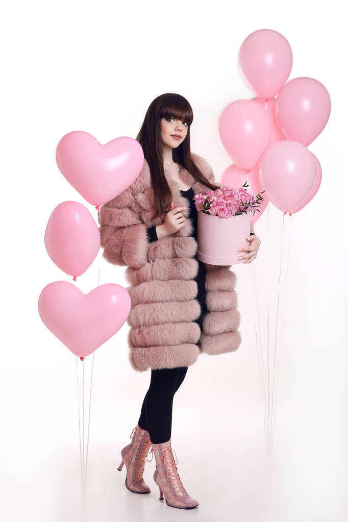 Fashion photo of fashionable woman in pink fur coat with rose bo - Photo, Image