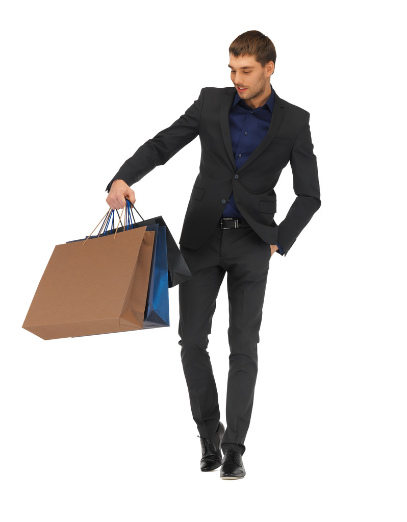 Bonito homem de terno com sacos de compras
 - Foto, Imagem