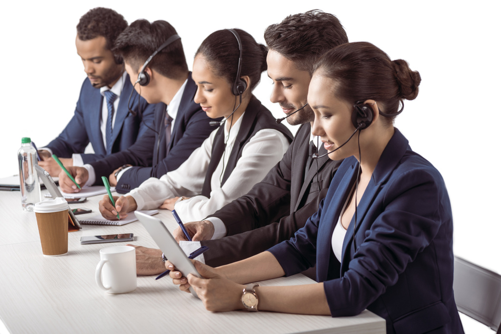 Call center operators in headsets  - Photo, Image