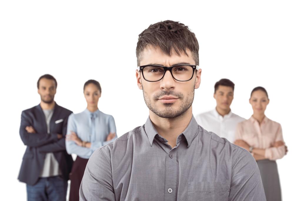 businessman standing in front of colleagues - Photo, Image