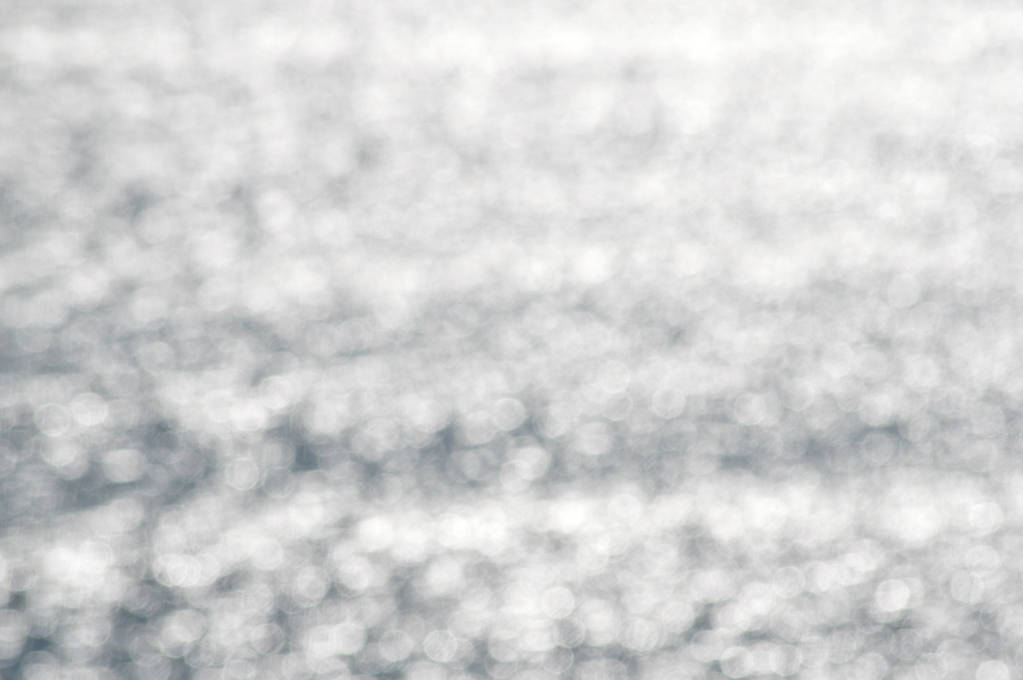 Sumentunut bokeh sileä valo valtameri aurinkoinen ulkona tausta. Syvänmeren kuvioitu mietiskely. luovuus koristelu
 - Valokuva, kuva