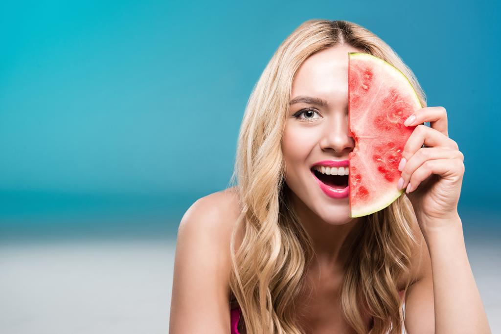 smiling woman holding watermelon piece - Photo, Image