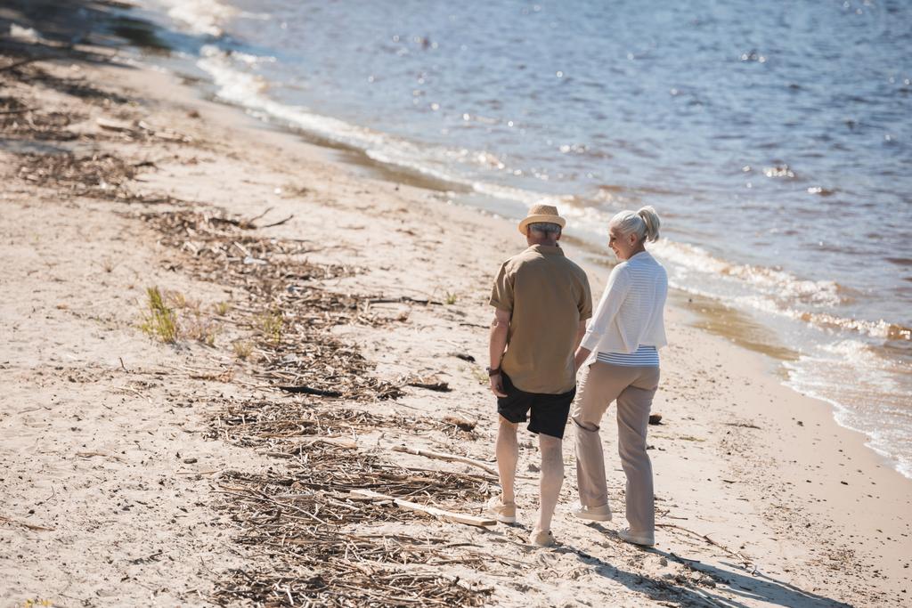 Senior couple walking on beach  - Photo, Image