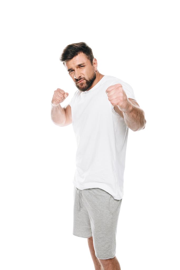 М'язистий чоловік готовий битися
  - Фото, зображення