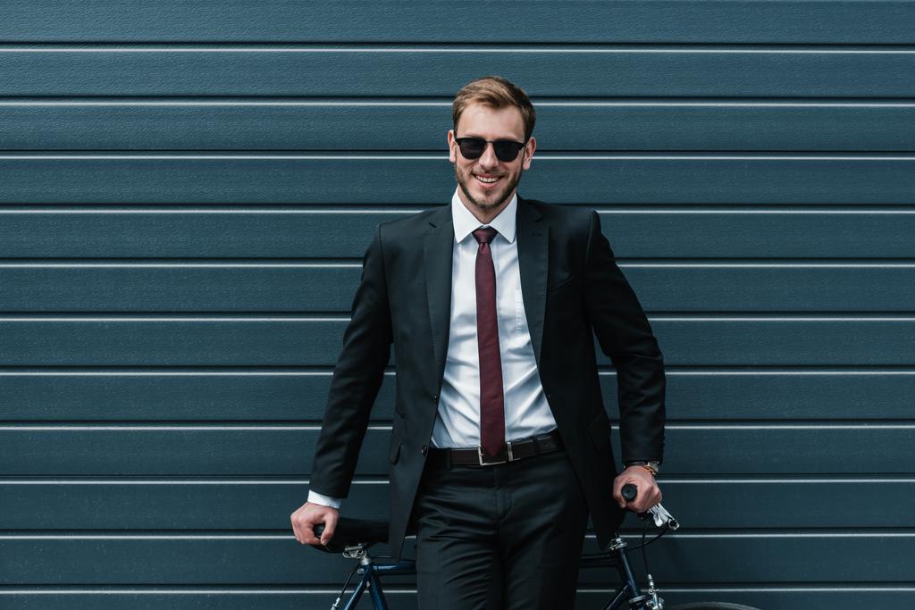 Stylish businessman with bicycle  - Photo, Image