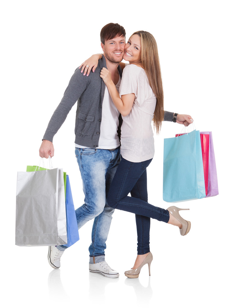 Chico y chica trae bolsas de compras
 - Foto, Imagen