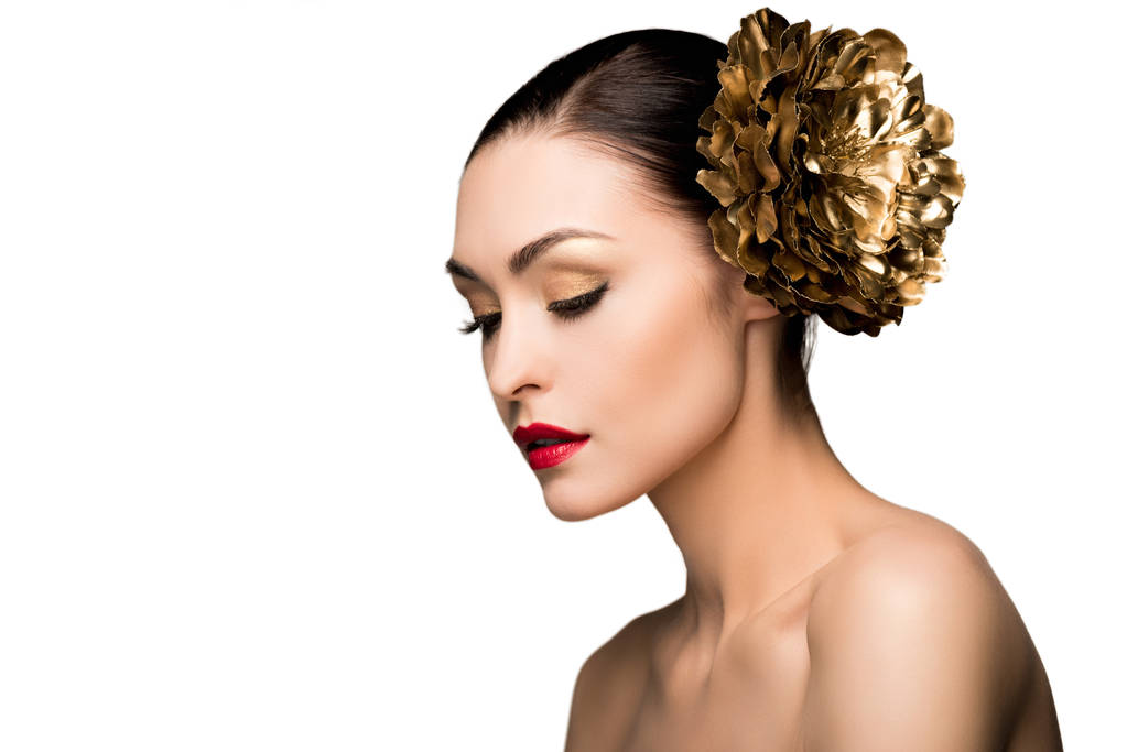 Menina com flor dourada no cabelo
  - Foto, Imagem