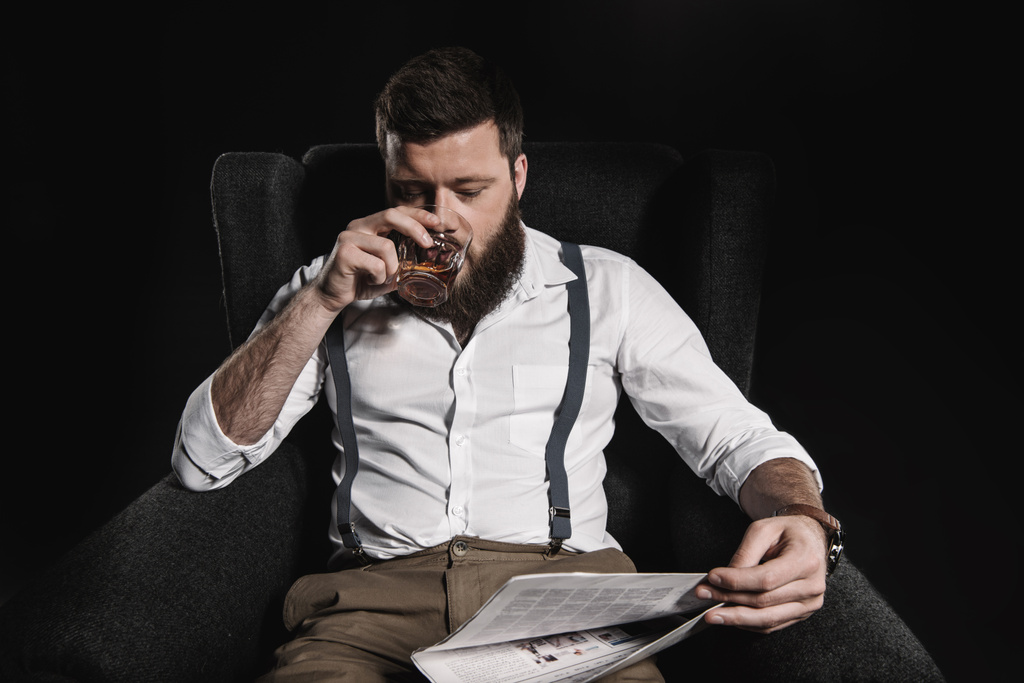 man with whisky and newspaper - Photo, Image