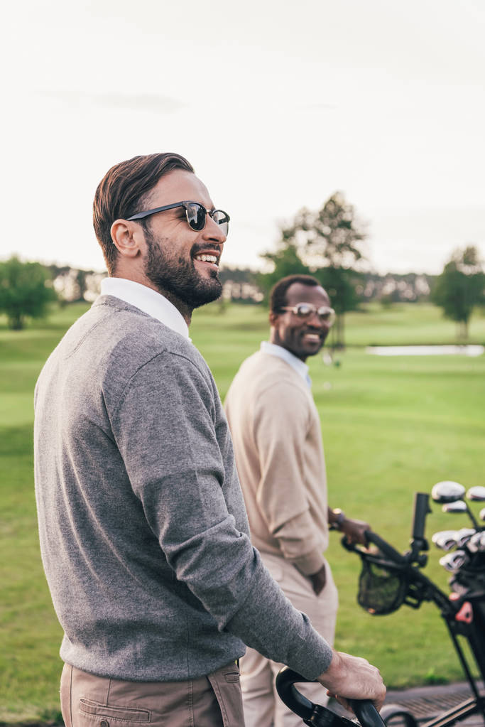 Muži s golfovými holemi v pytlích  - Fotografie, Obrázek