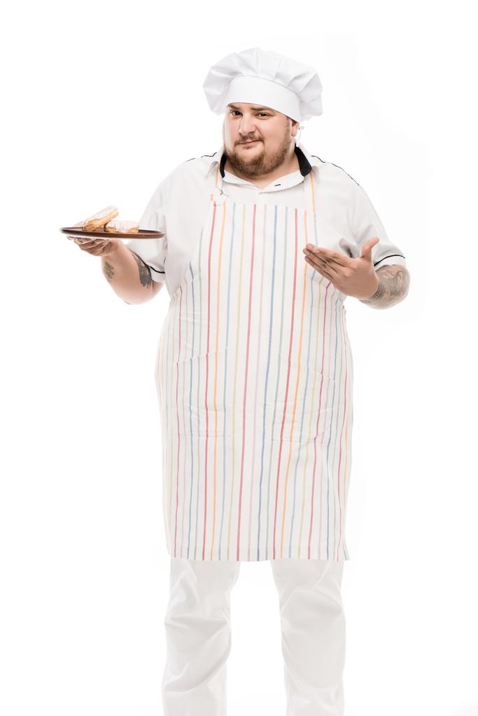 chef con rosquillas en plato
 - Foto, Imagen