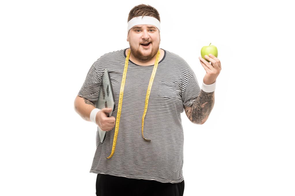Muž, který držel tělesné váhy a apple - Fotografie, Obrázek