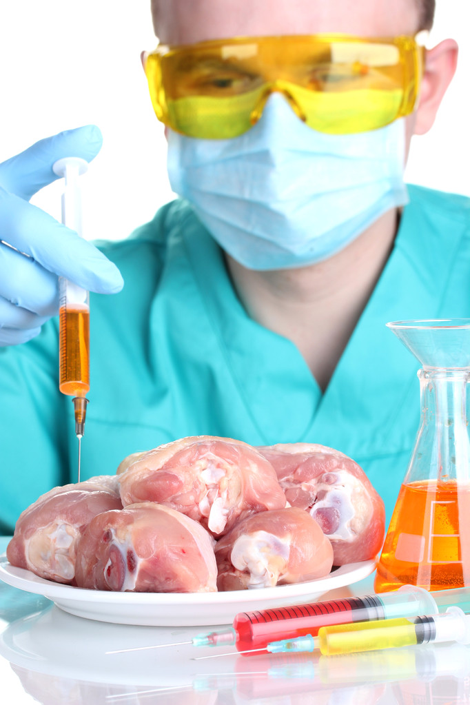 Scientifique injectant des OGM dans la viande
 - Photo, image