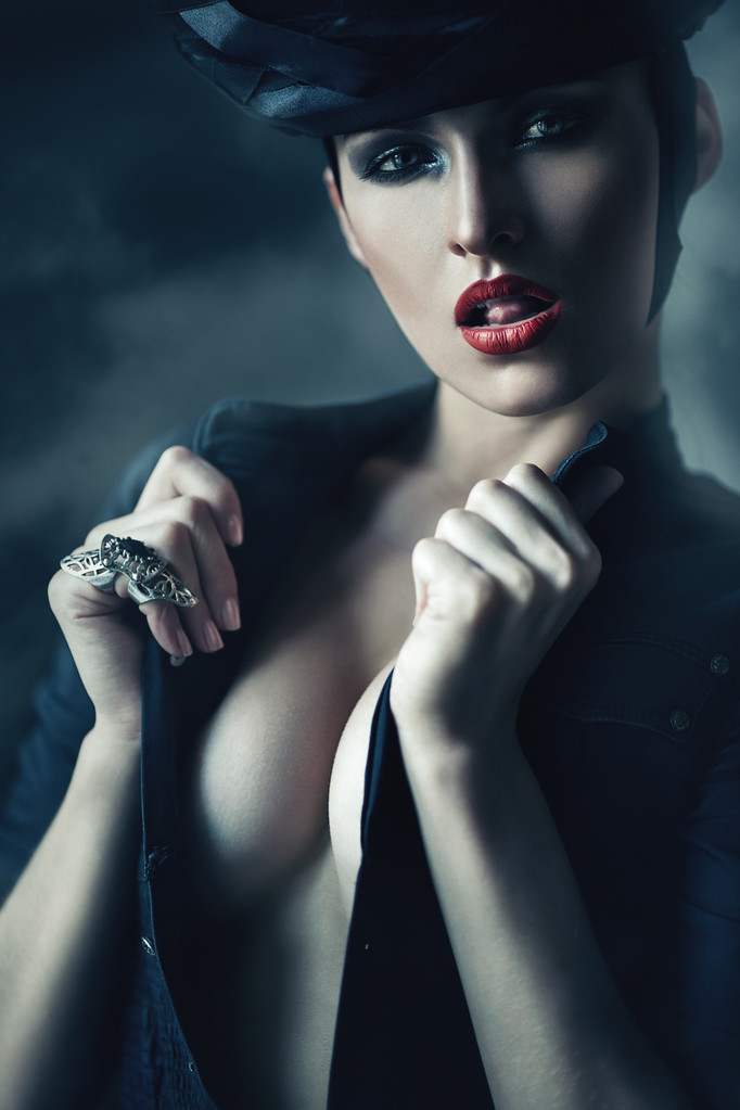 hot woman in black showing tongue - Photo, Image