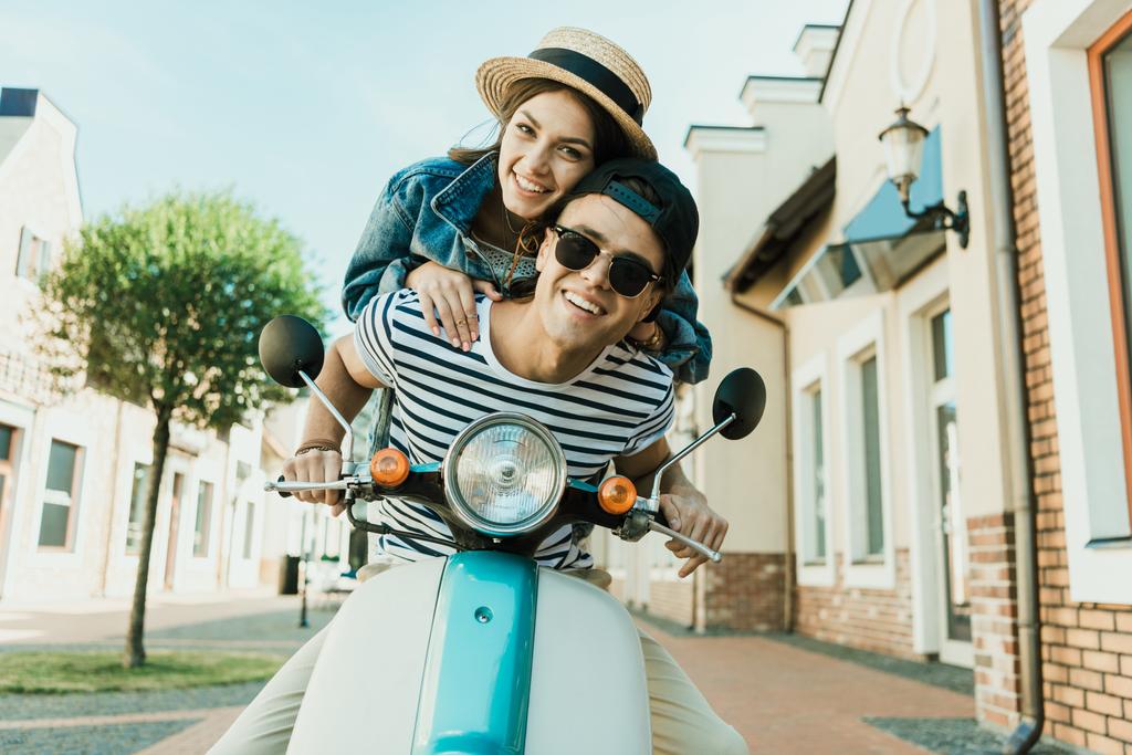 Young couple riding scooter  - Photo, Image