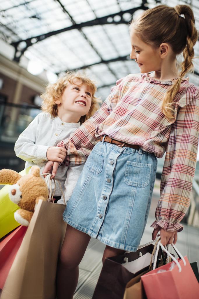 children holding shopping bags   - Photo, Image