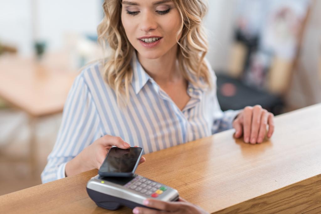 payment with smartphone by woman - Photo, Image