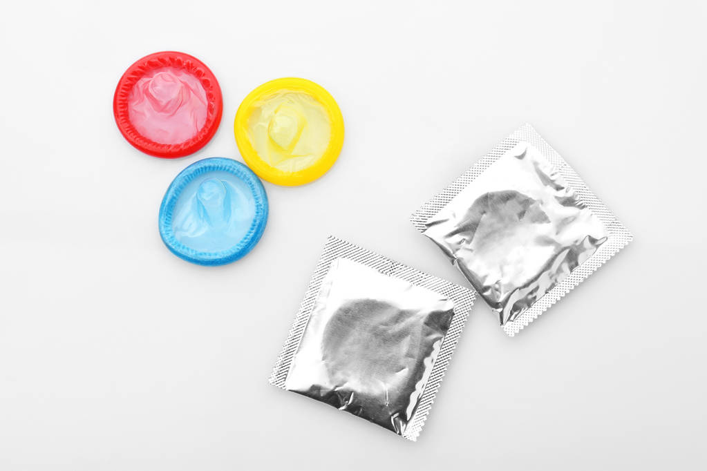 eri värikkäitä kondomeja
 - Valokuva, kuva
