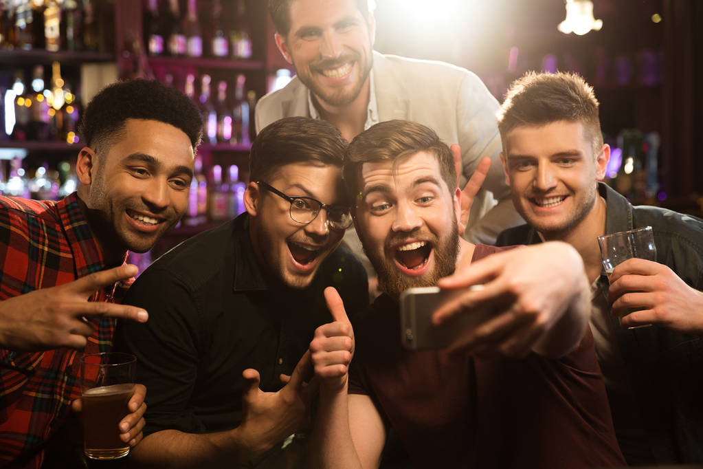 Happy male friends taking selfie and drinking beer - Photo, Image