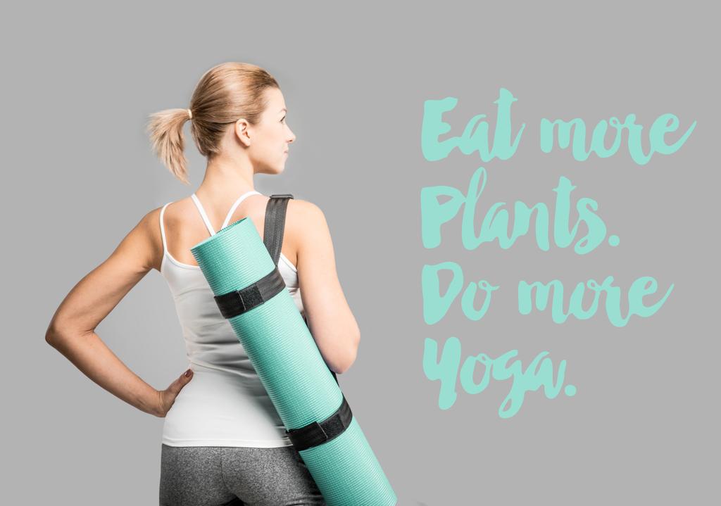 Sportvrouw bedrijf yoga mat   - Foto, afbeelding