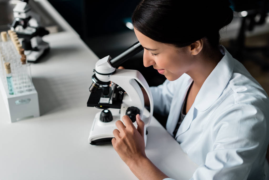 Scientist with microscope in lab - Photo, Image