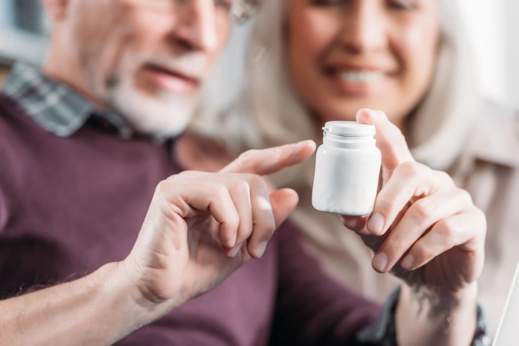 couple with pill bottle - Photo, Image
