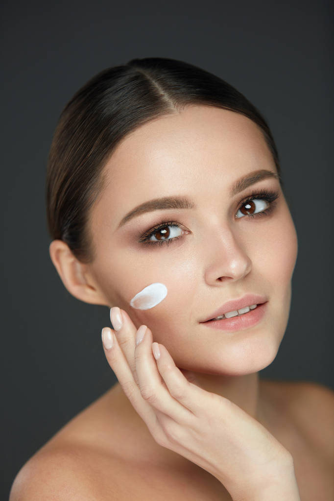 Beautiful Woman Face With Cream On Fresh Soft Skin. Cosmetics - Photo, Image